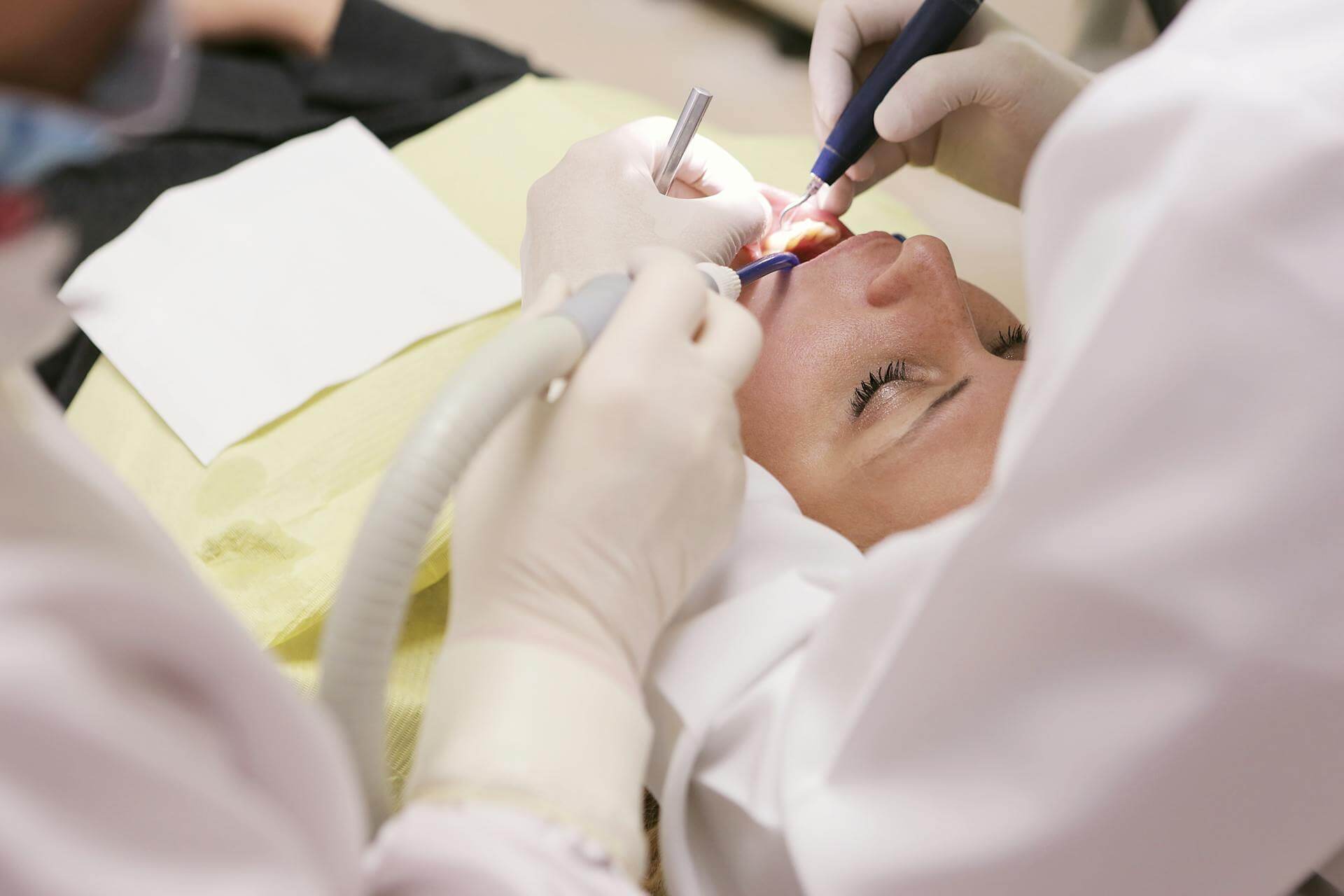 Dentist Working on Woman's Teeth