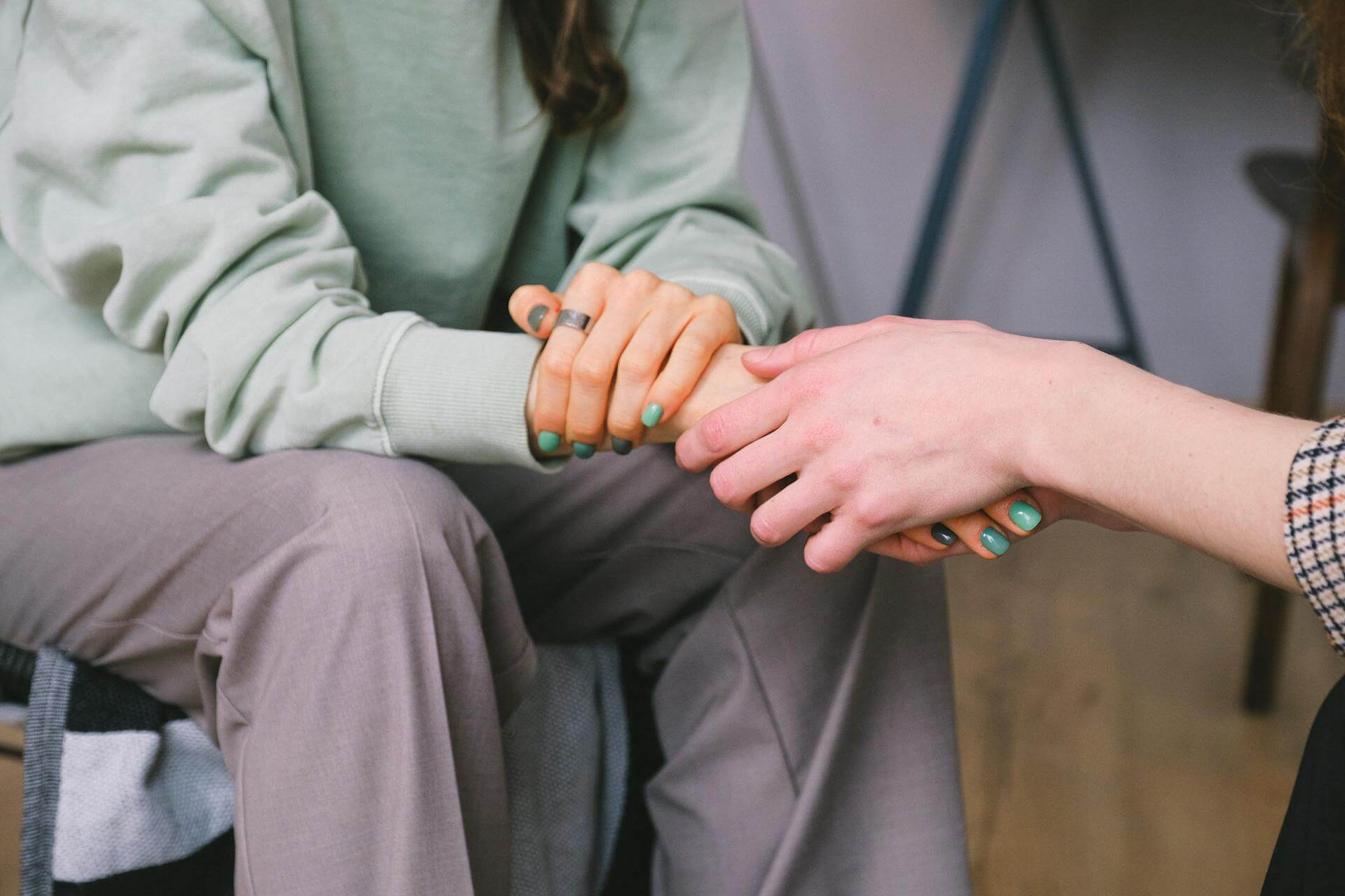 psychologist supporting patient during counseling indoors
